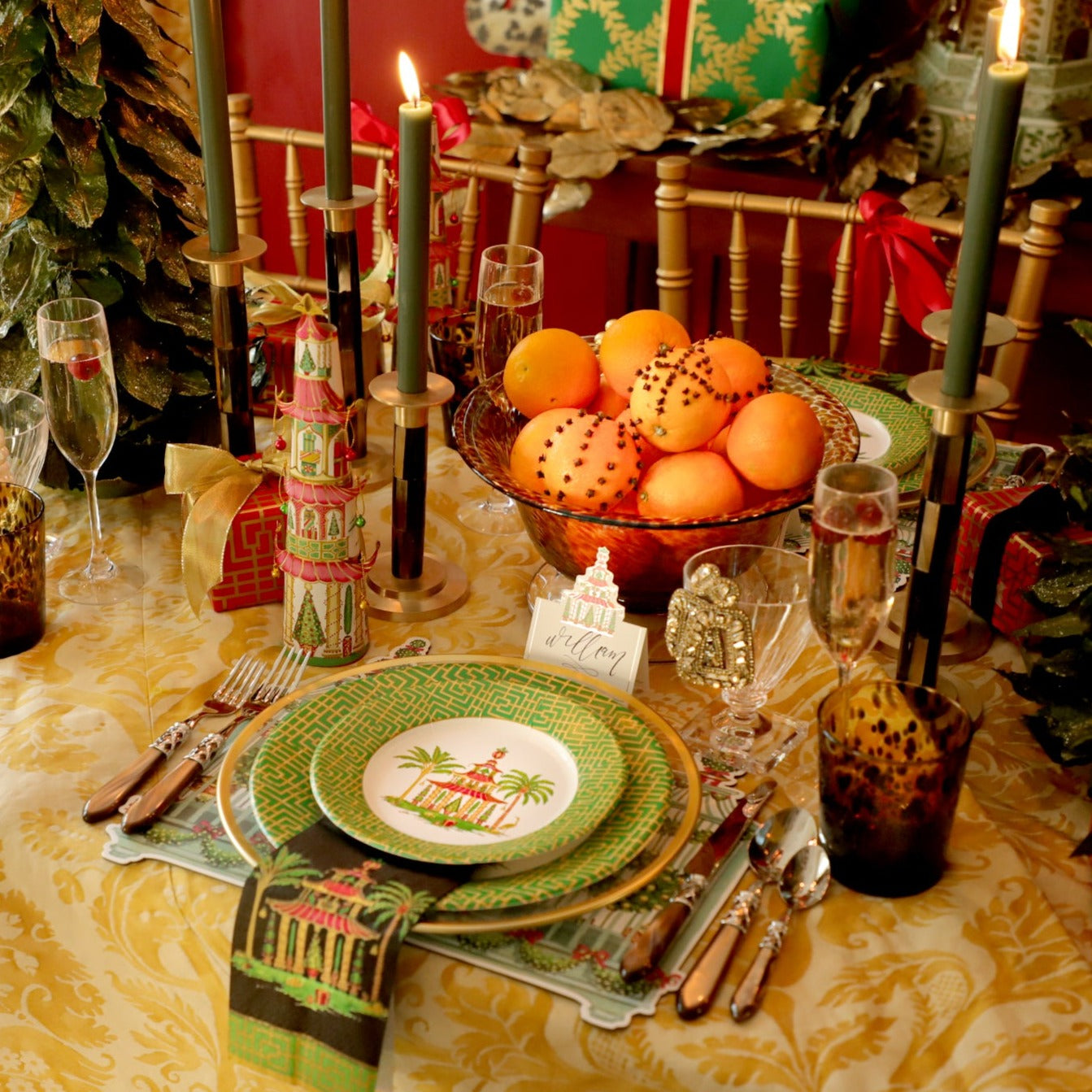 Christmas table scene showing pagoda design paper plates, place card and other Christmas table decorations