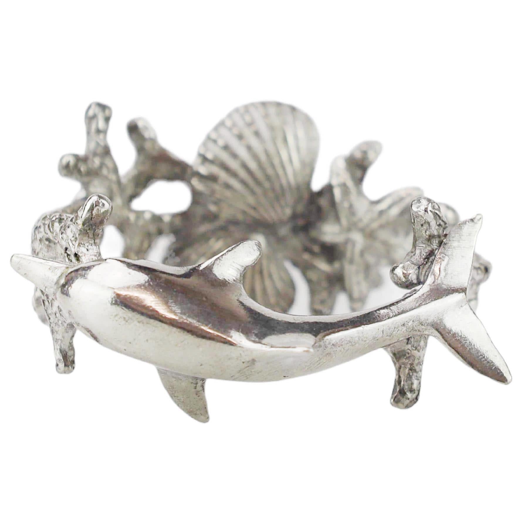 Close up of Pewter Dolphin Napkin Ring showing Dolphin,Coral and Shells on the ring
