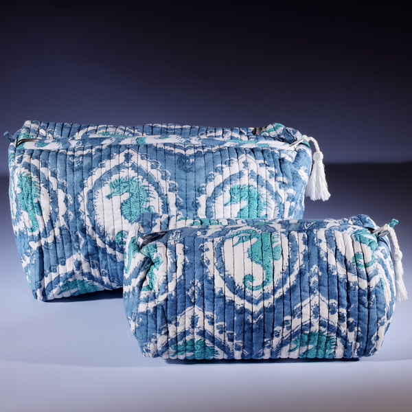 Tubular shaped cosmetic bag with Seahorse Cameo design,the larger one placed behind the smaller one.