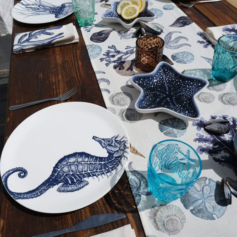 Cotton and Linen mix table runner with hand drawn illustrations with our Rockpool design on a table decorated with our classic plates,cutlery,glassware and other table decorations