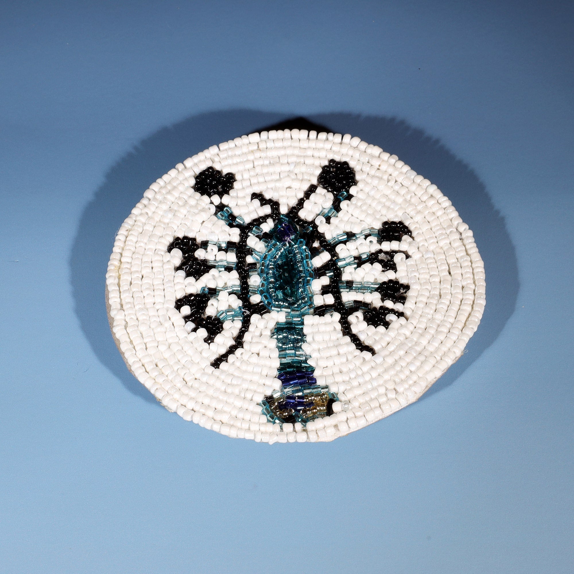 Handmade glass beaded coaster with a lobster design in Navy,Black and gold on white glass beads