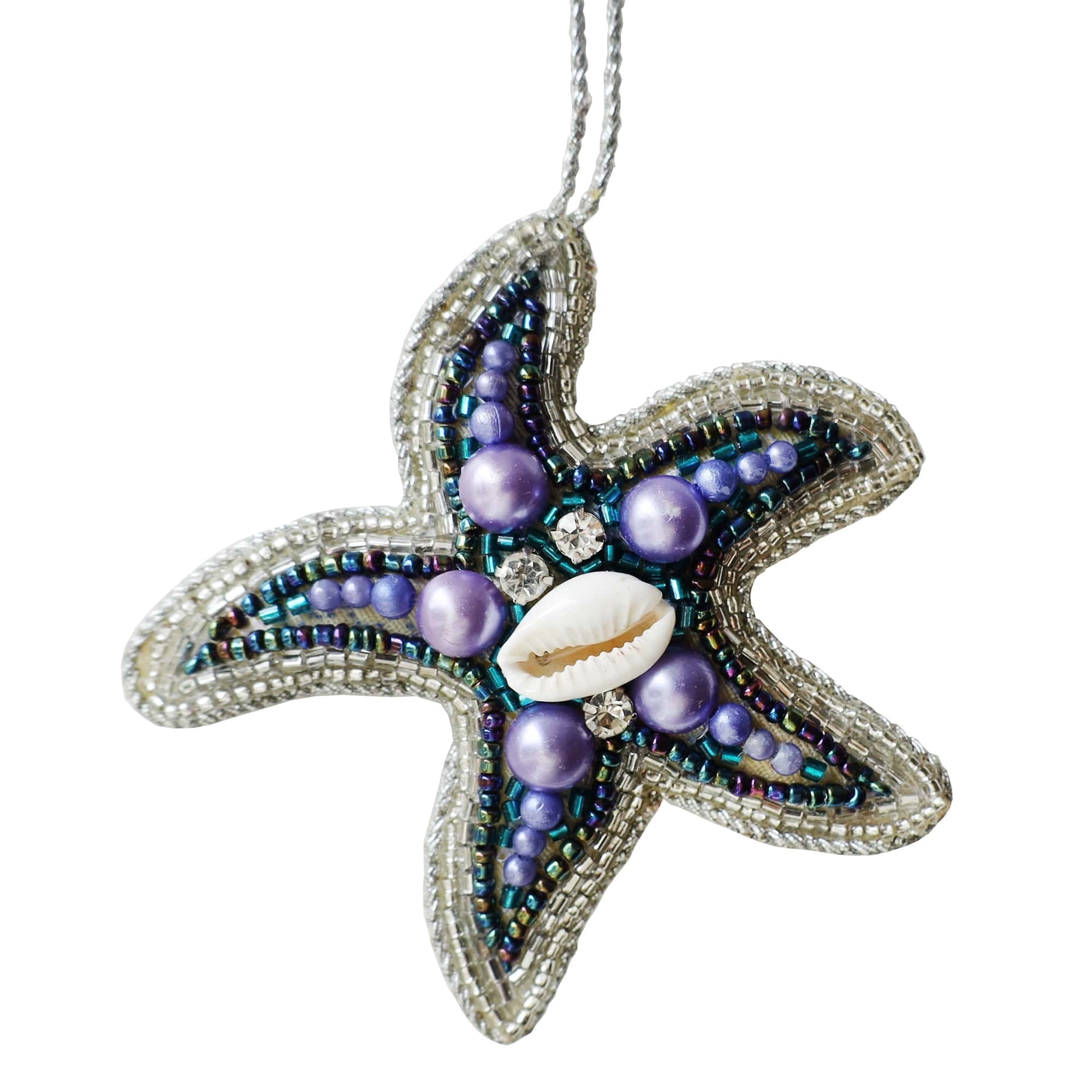 Hand-beaded starfish ornament featuring intricate silver and purple beads, sparkling gems, and a central shell. This coastal-themed decoration adds a touch of the ocean to any decor, perfect for beach lovers or as a unique gift.