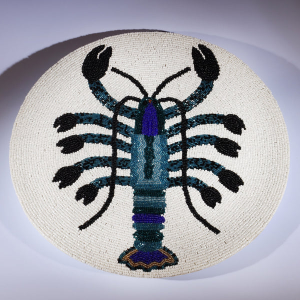 Handmade glass beaded placemat with a Lobster design in Navy,Black and gold on white glass beads