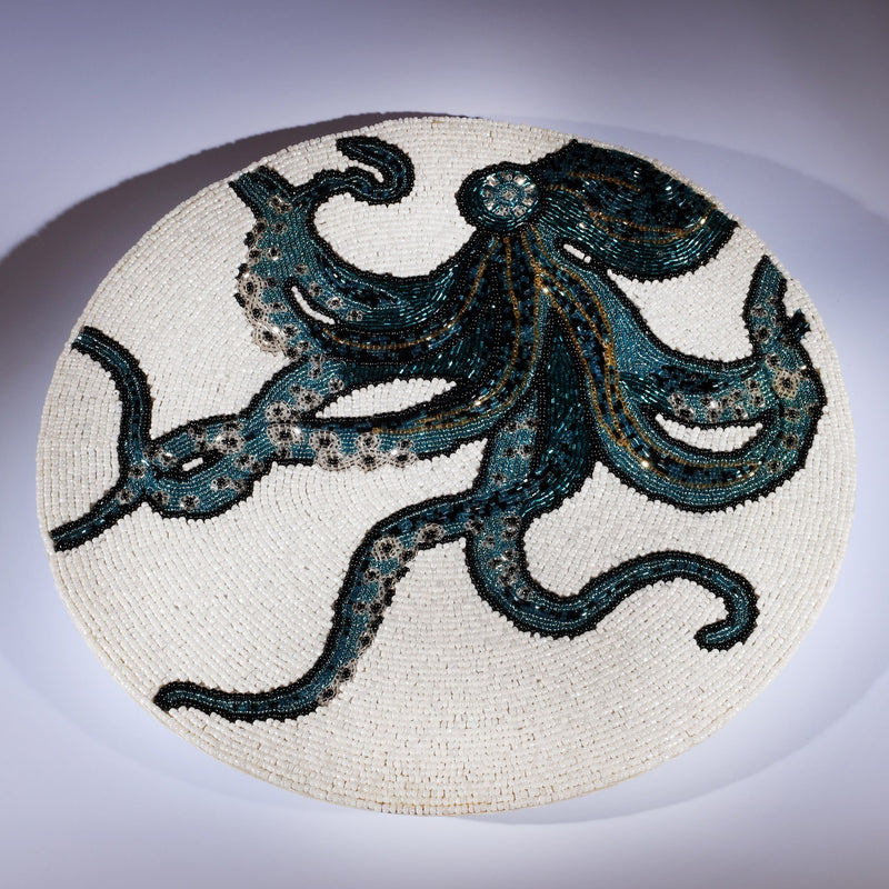 Handmade glass beaded placemat with a Octopus design in Navy,Black and gold on white glass beads