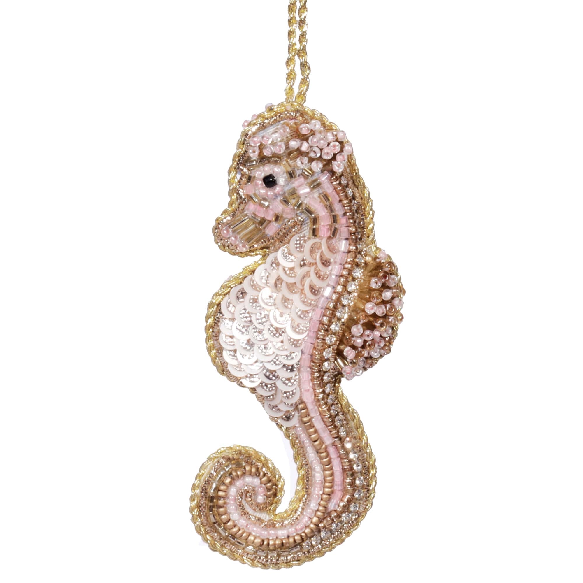 Alt text: Hand-beaded pink and gold seahorse ornament with intricate detailing, inspired by the coastal beauty of Cornwall, UK. The seahorse features a mix of shimmering beads, adding a touch of elegance and seaside charm. Ideal for home decor or as a thoughtful gift.