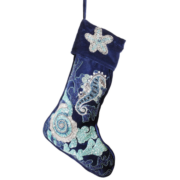 dark blue velvet christmas stocking decorated with blue beads and silver beads with corals, seaweed starfish, ammonite and seahorse.