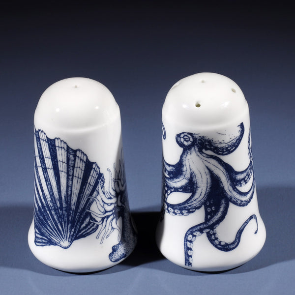 Bone china salt an pepper pots in our classic navy and white.Salt has seahorse, shell and an anenome on and the pepper has an octopus  