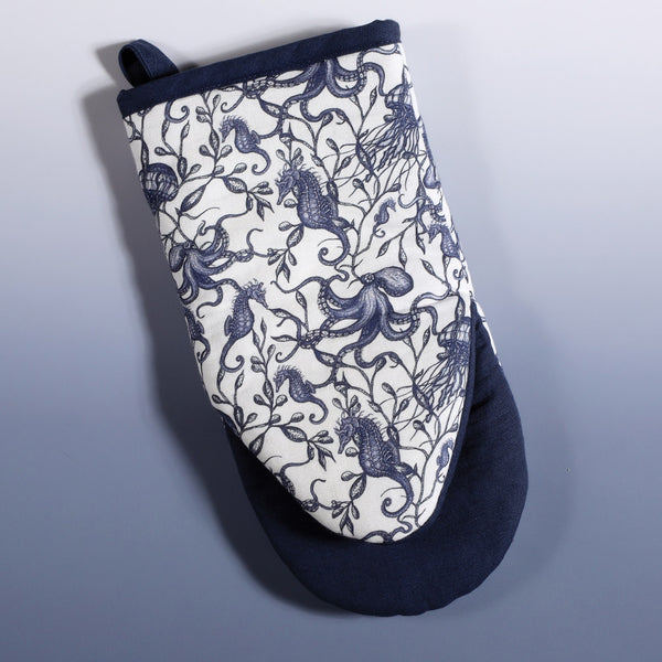 Reverse view cotton and Linen mix oven mitt with hand drawn mini illustrations of Seahorses,Octopus and seaweed in navy with navy trim
