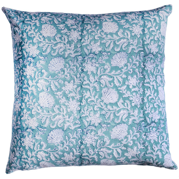 Sea Breeze Seaflower  cushion which is Hand block printed fabric in a turquoise blue and the print is swirling shells and tendrils in white.