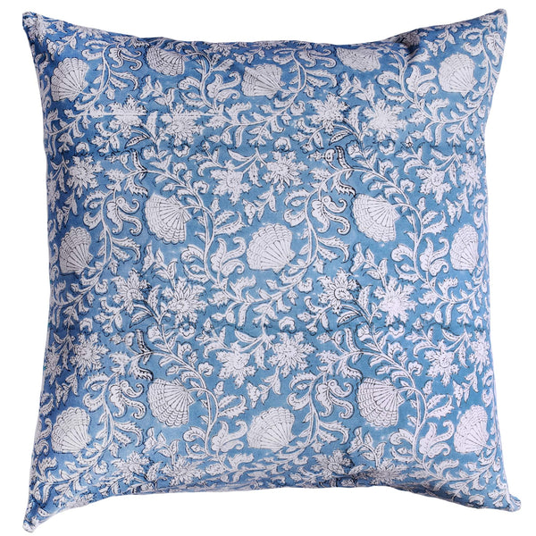 Seashell Flower cushion which is Hand block printed fabric in a soft blue and the print is swirling shells and tendrils in white. 