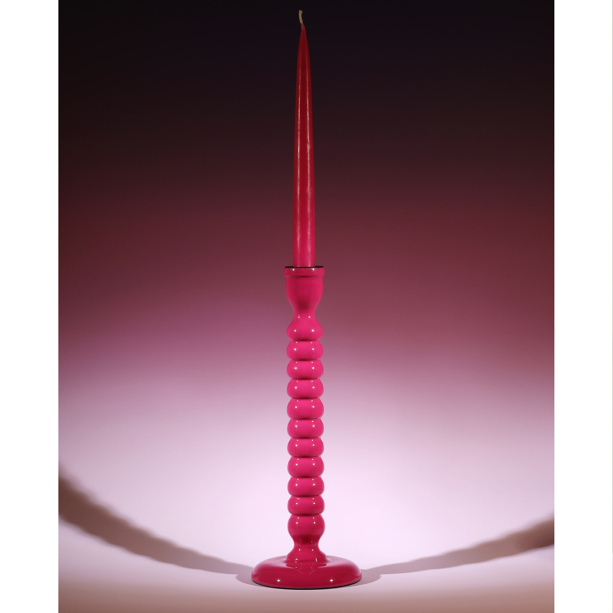 Fuschia Polished Lacquer Drift Candle holder with a matching candle