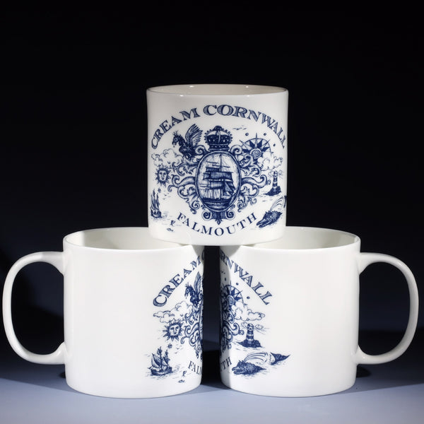 3 extra large 1 pint white bone china mugs. 2 at the bottom and one on top so that all the different sides of the design are shown. The design in navy blue is inspired by vintage maritime illustrations of ships, lighthouses, compasses, heraldic motifs and sea monsters with the place name Falmouth at the bottom.
