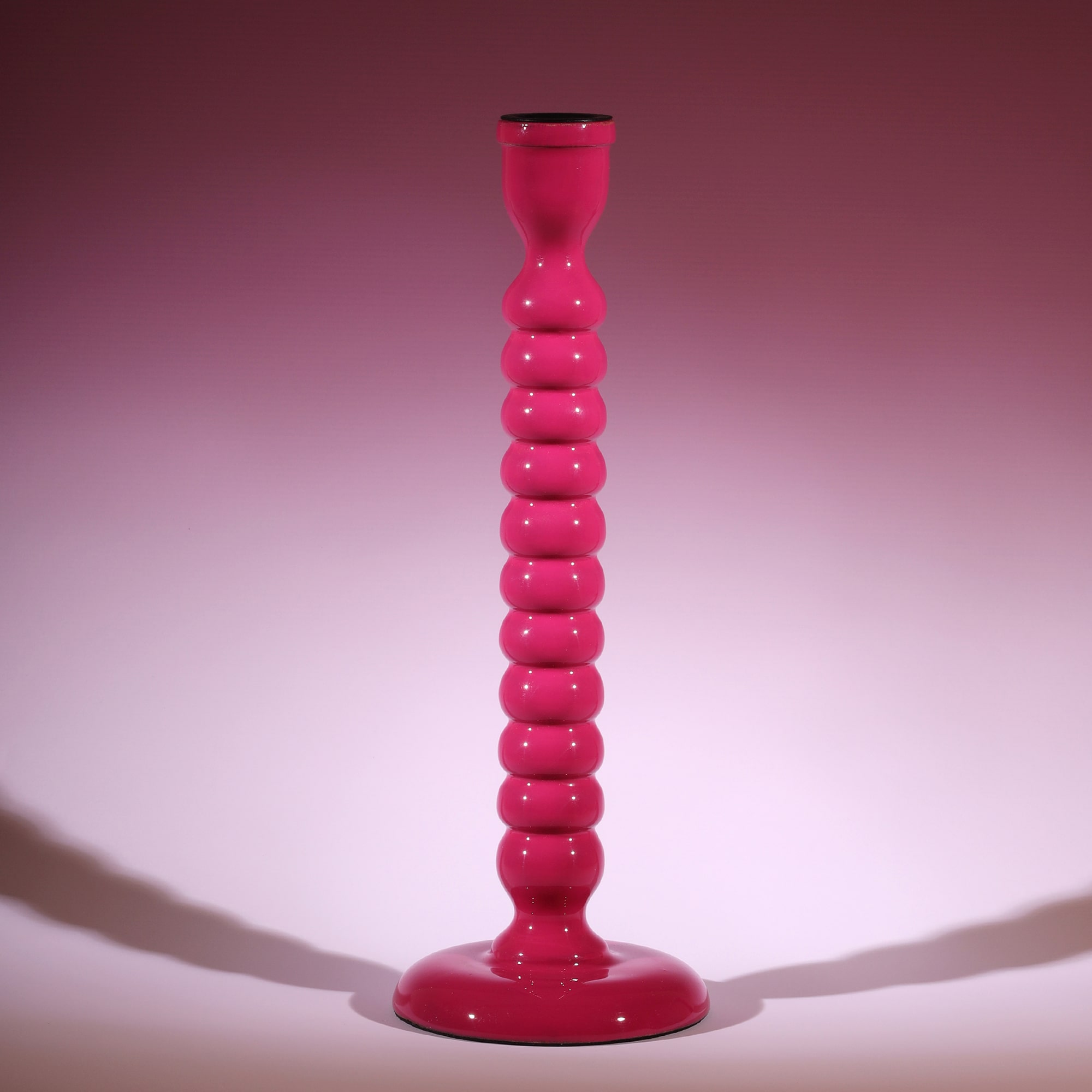 Fuschia Polished Lacquer Candle holder,it is twisted all the way down like a corkscrew tapered at the bottom.