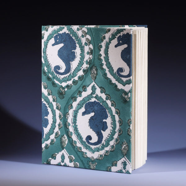 Hand Block printed hard backed notebook Seahorse Cameo in Ocean  on its side