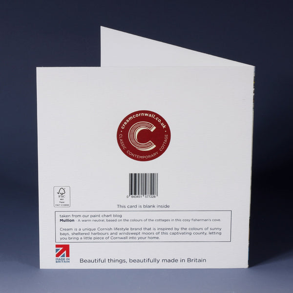 back of white greeting card with barcode, description and red cream cornwall logo standing on an ombre boue background