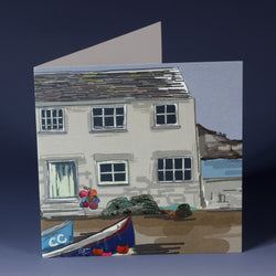 greeting card with illustration of a classic fishermans cottage with bouys, lobster pots and boats 