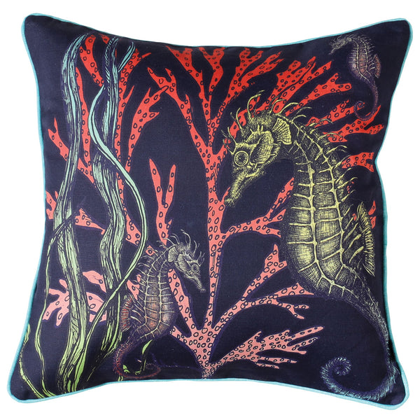Navy piped linen cushion with Turquoise back.Front has hand drawn illustrations of Seahorses swimming amongst red and green Seaweed
