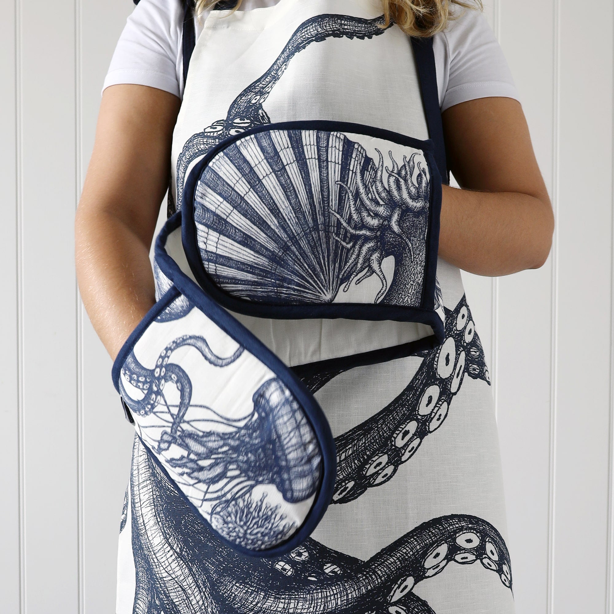 Model wearing our sea creature apron and modelling the matching sea creature gloves