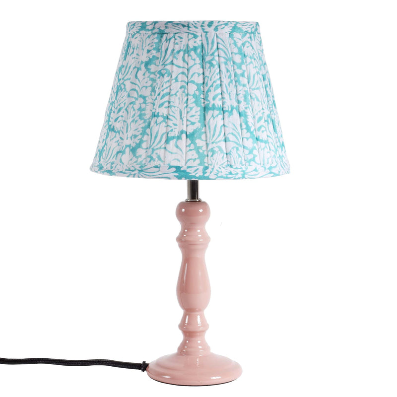 Small pleated Summer Skies Coraline pleated lampshade on a pink lampbase
