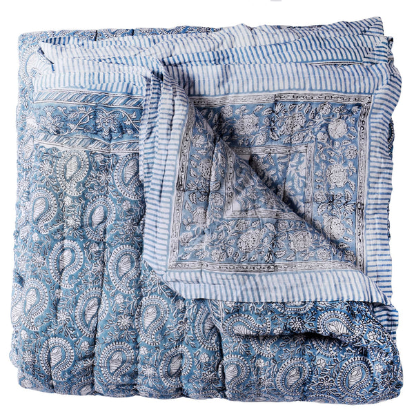  Paisley Shell Hand Blocked Quilt cushion which is Hand block printed fabric in a soft blue and white, the print is a repeat paisley with a shell theme throughout with swirling flowers.Edged in a soft blue and white stripe.