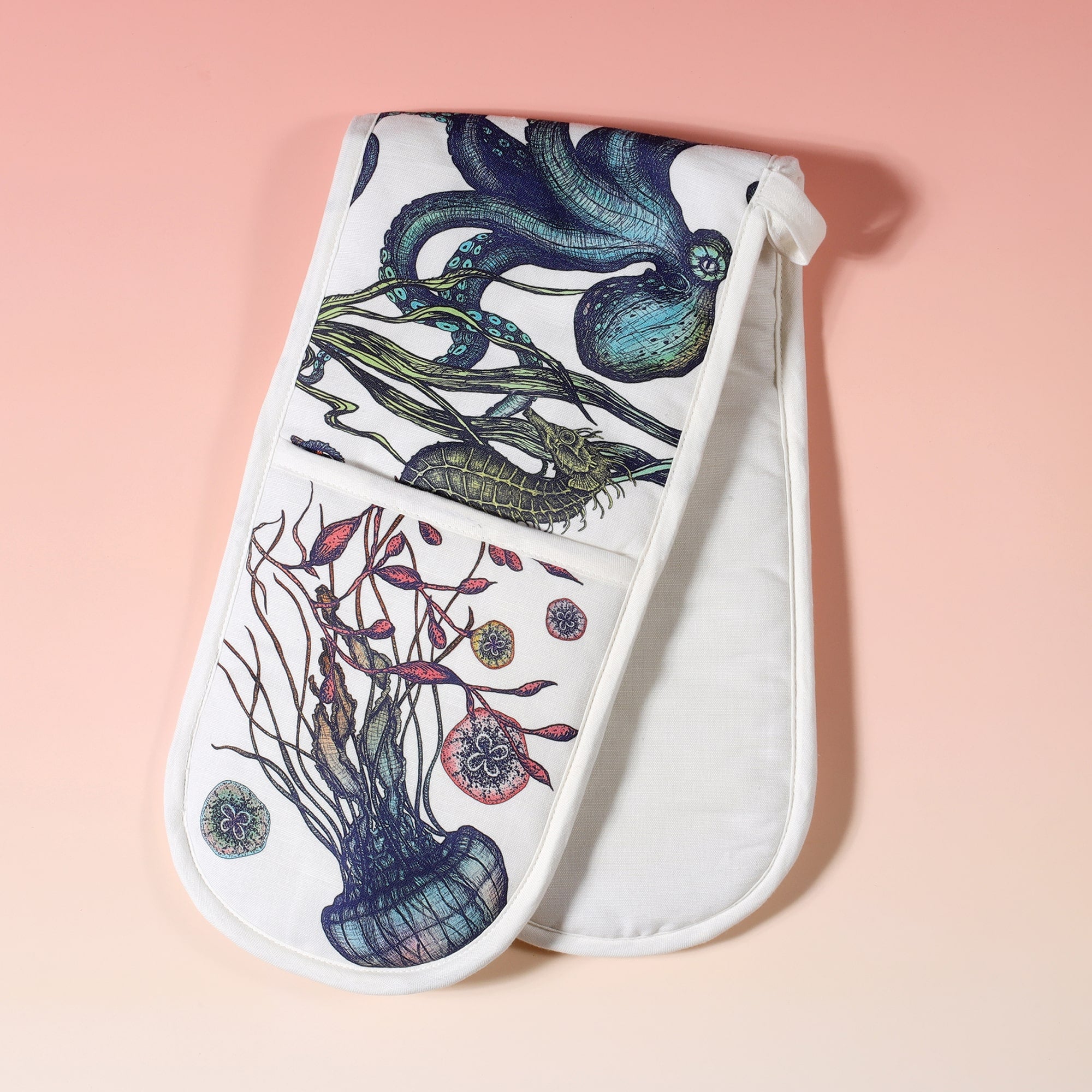 Cotton and linen mix oven gloves with hand drawn illustrations of coloured reef print of Jellyfish,seahorses,starfish and Octopus  