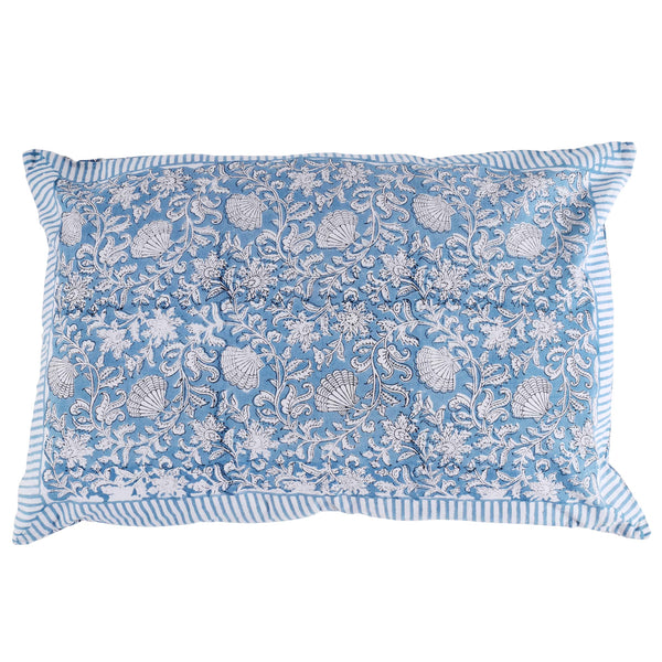 Seashell Flower pillowcase which is Hand block printed fabric in a soft blue and the print is swirling shells and tendrils in white.The edge is finished with a matching soft blue and white stripe.