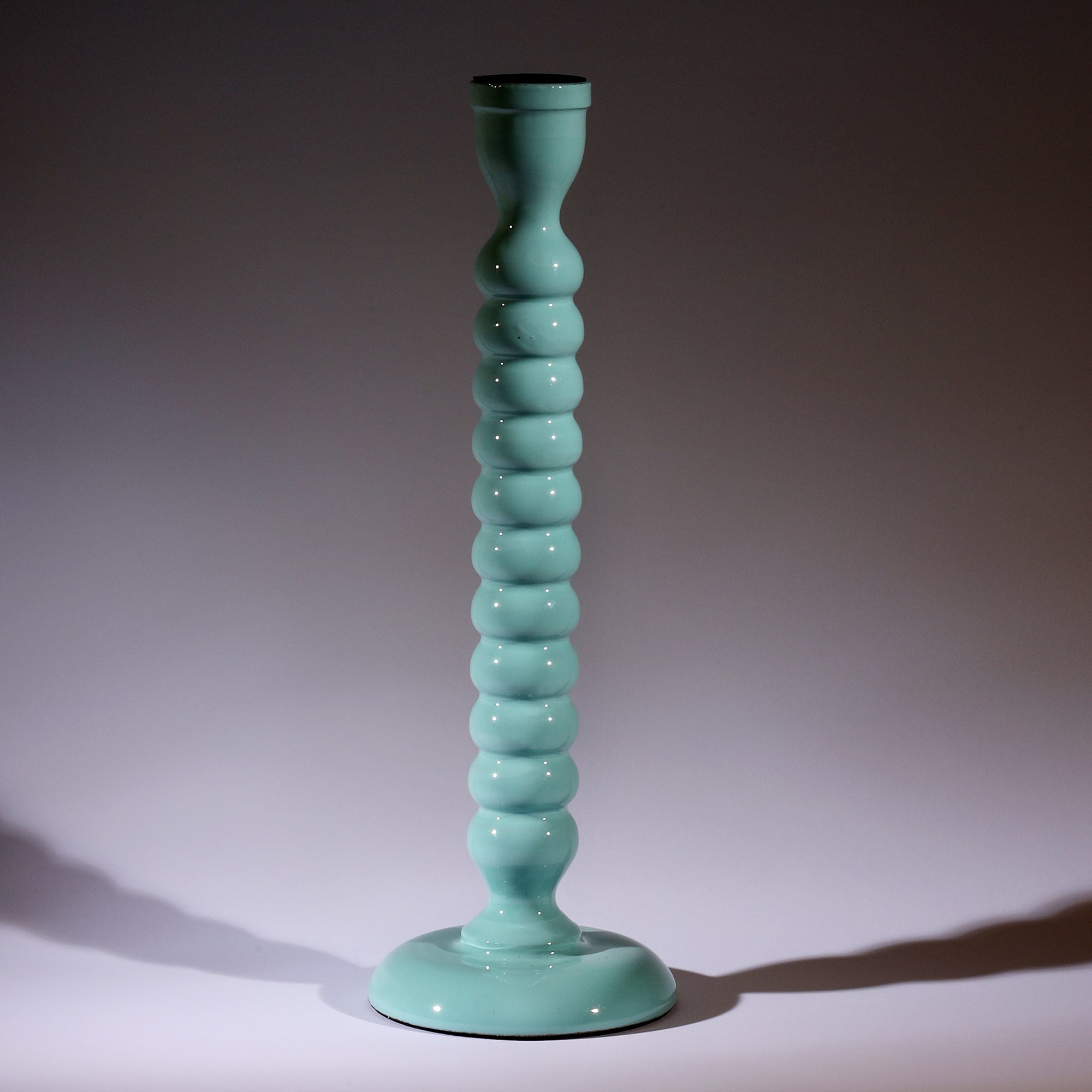 Seashell Blue Polished Lacquer Candle holder,it is twisted all the way down like a corkscrew tapered at the bottom.