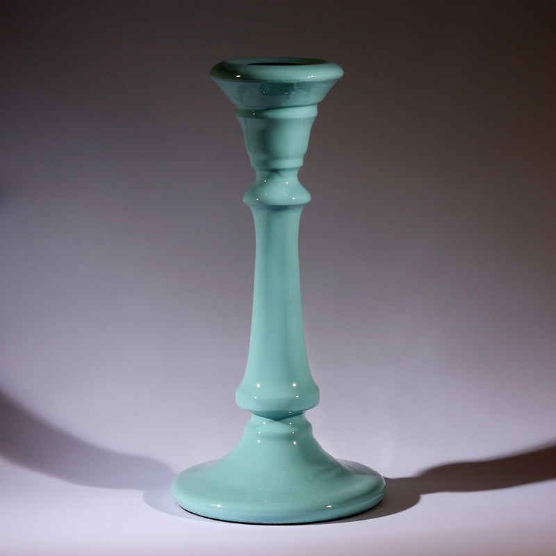 Seashell Blue Polished Lacquer Candle holder,tapered at the top,moving down it has various section and a long smooth piece to finish with a tapered base