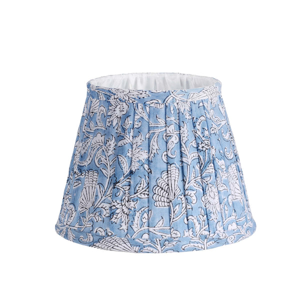 Small pleated Blue lampshade in hand blocked print in blue and white.Finished on the edge with fabric and lined in white.