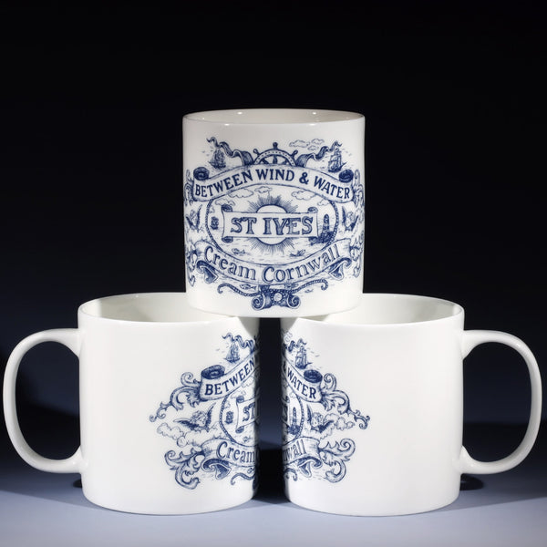 3 extra large 1 pint white bone china mugs. 2 at the bottom and one on top so that all the different sides of the design are shown. The design in navy blue is inspired by vintage maritime illustrations of ships, lighthouses, compasses, heraldic motifs and sea monsters with the place name St Ives at the bottom.
