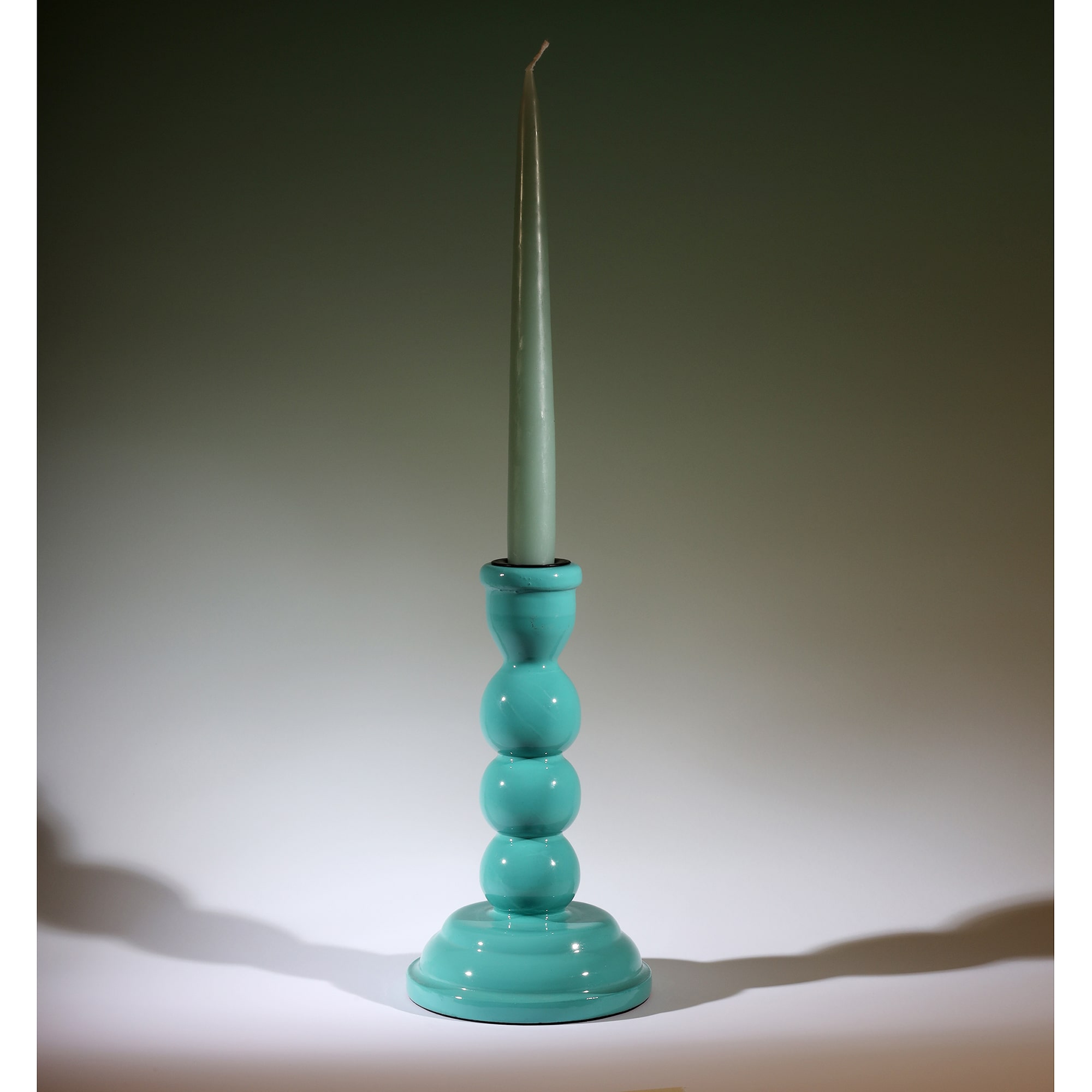 Turquoise Polished Lacquer Candle holder with a contrasting candle