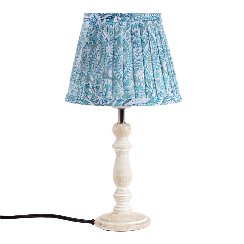 Small pleated Seafoam Paisley Shell lampshade in hand blocked print on a wooden  lampbase.