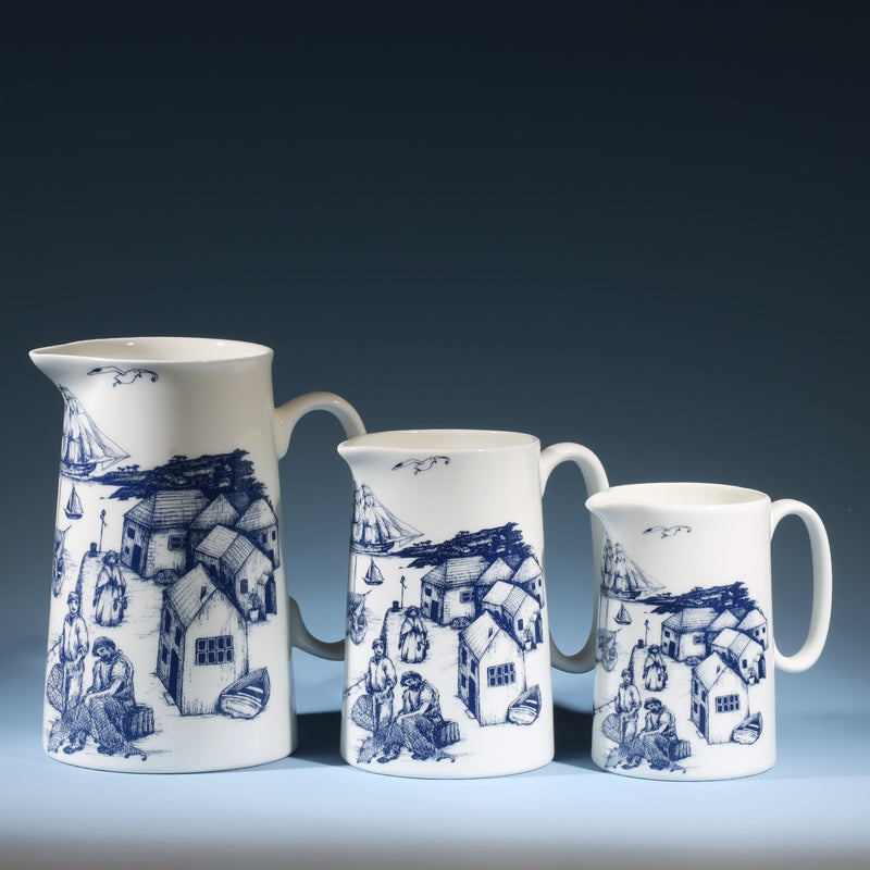 Three Bone China white Jugs with hand drawn illustration of our Harbourside scenes  in Navy.There are three sizes Large,Medium and the small