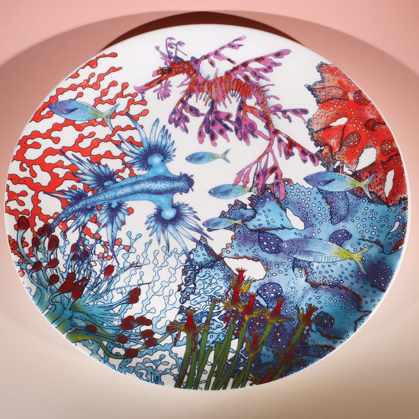 Large Bone China White 30cm diameter plate with hand drawn illustration of our Reef designs.Beautiful shades of corals and blues in an underwater fish theme