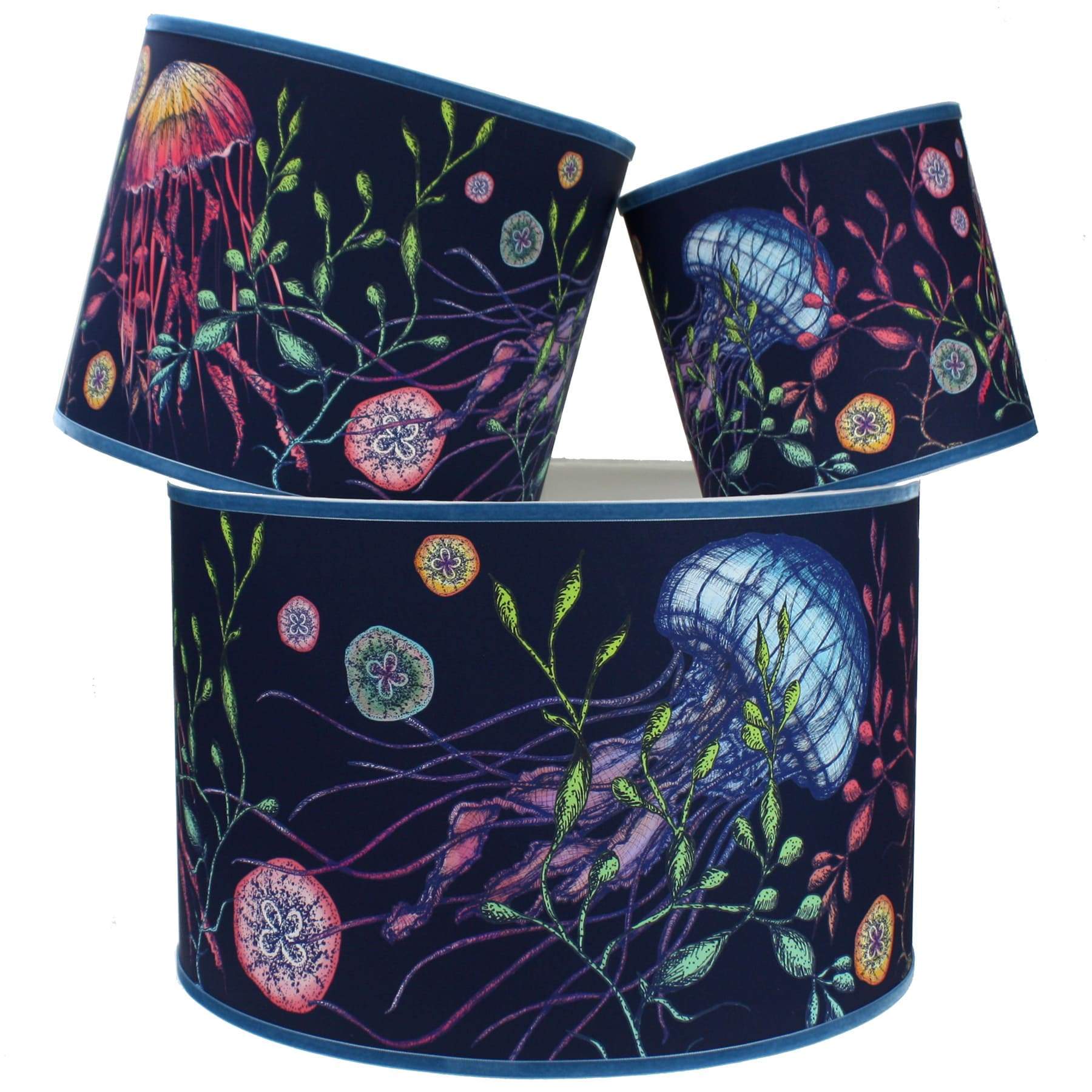 Canyons Reef Navy Shade With Jellyfish Design in bright colours with a blue trim on the edge of the shade.The lampshades are shown in a stack of three showing all three sizes.