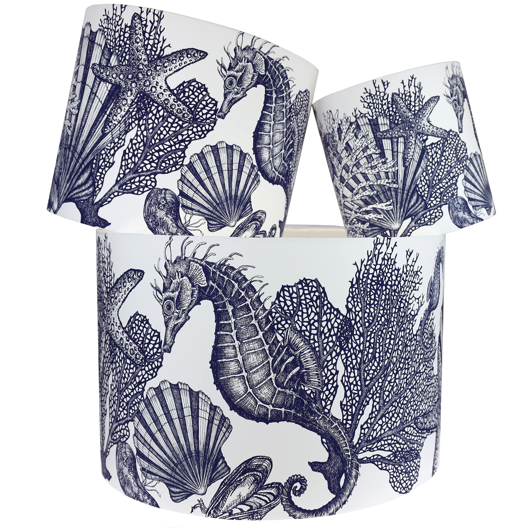 Our Classic Navy Seahorse design on a white background.The lampshades are shown in a stack of three showing all three sizes.