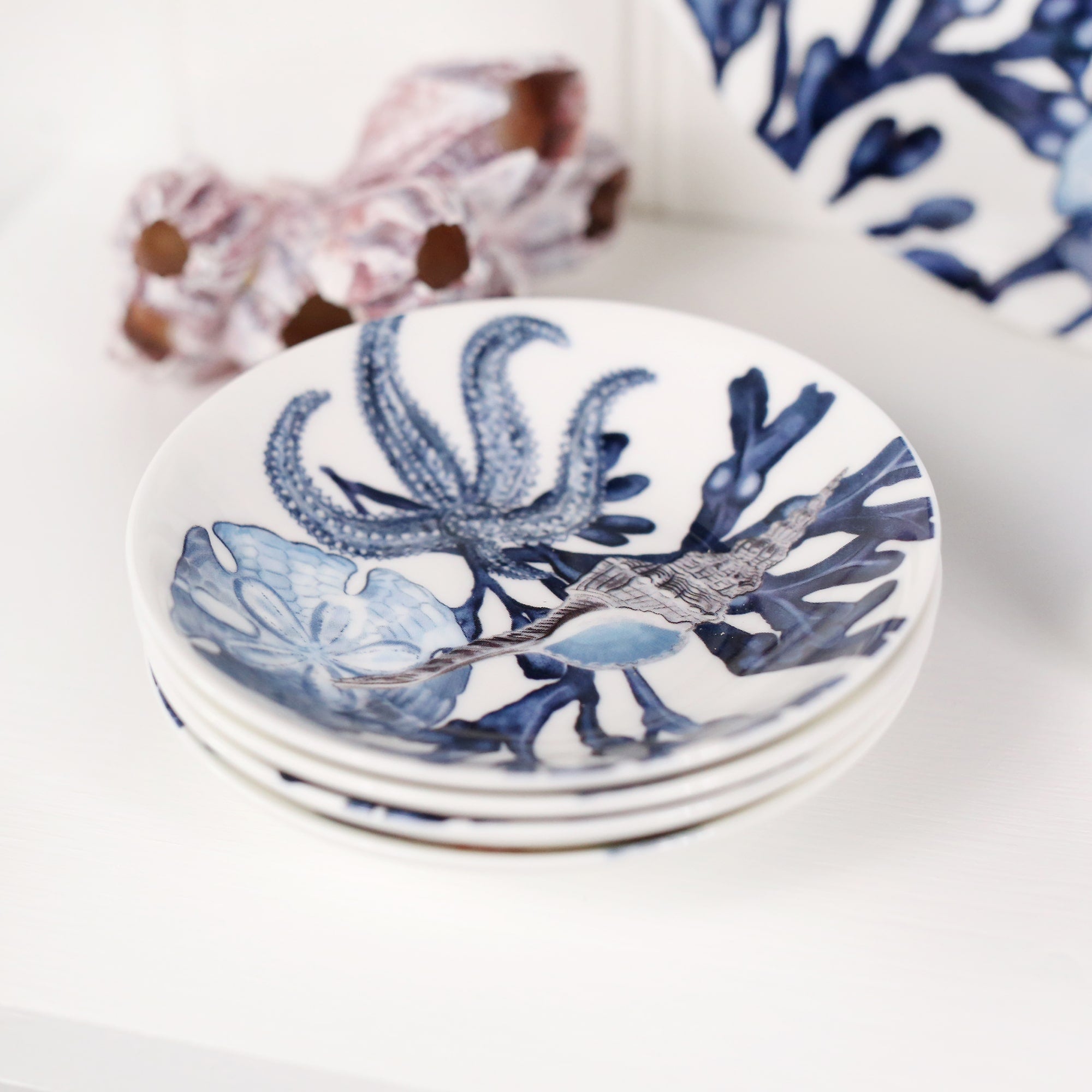 Nibbles bowl in Bone China in our  Seashell Beachcomber range in Navy and white in a Starfish,seaweed and shells design in a stack