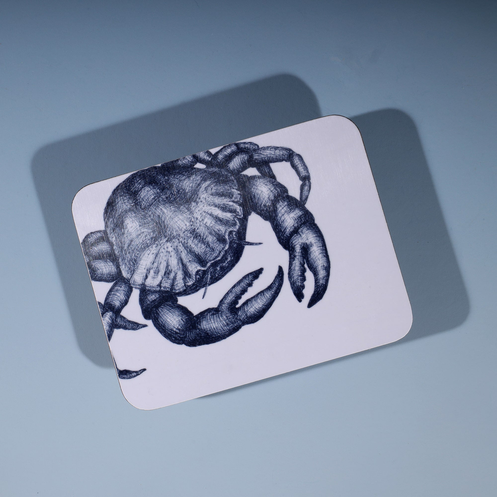 Crab Design in Navy on a white Coaster
