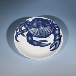 Bone China White plate with hand drawn illustrations of our Crab design on a side plate in Navy