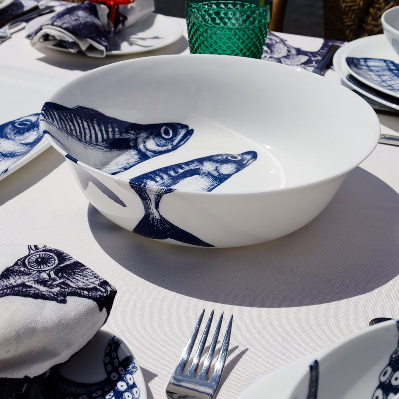 Serving bowl in Bone China in our Classic range in Navy and white in the Mackerel design on a white tablecloth also on the table are other Cream pieces of tableware