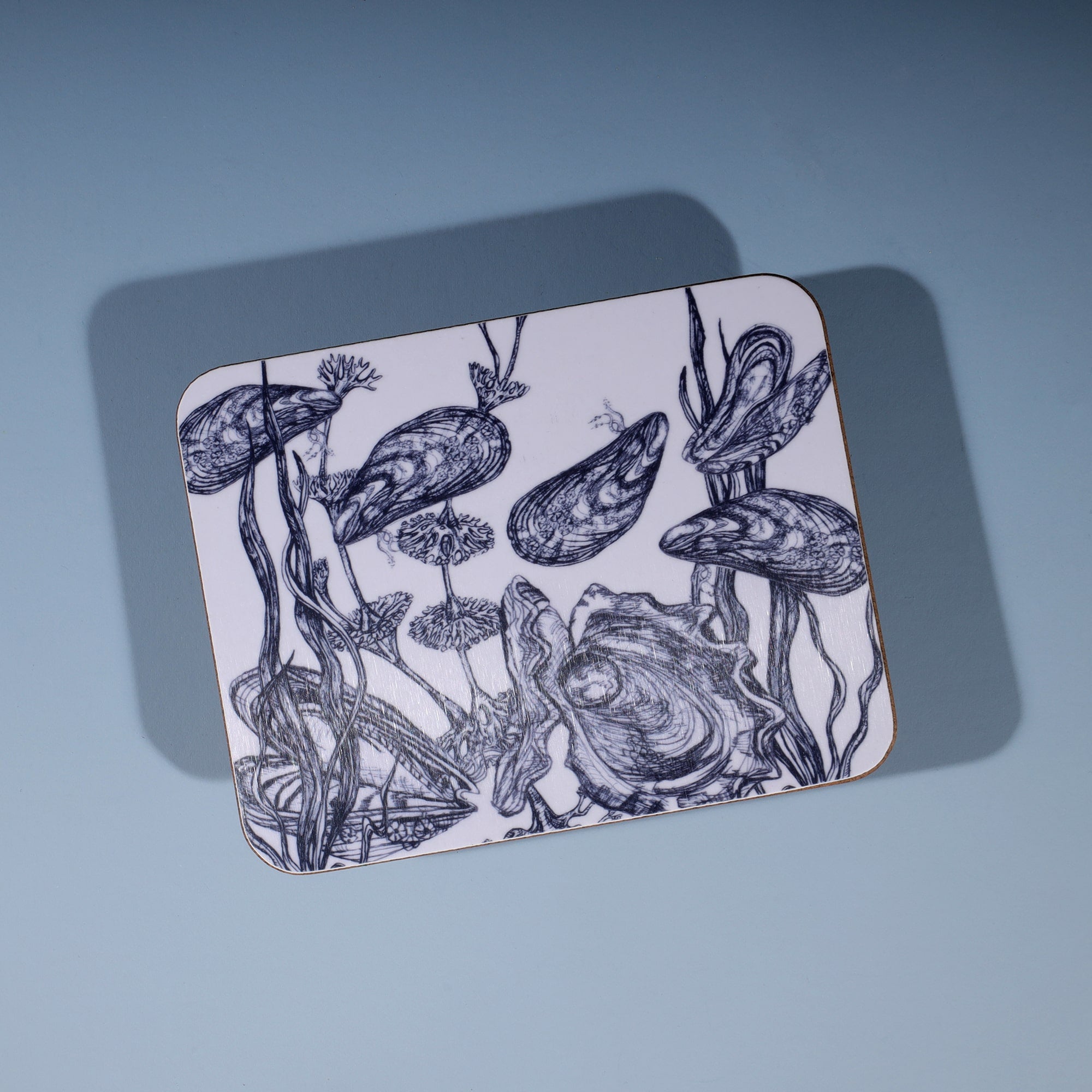 Mussels and Oyster Design in Navy on a white Coaster