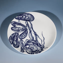 Bone China White dinner  plate with hand drawn illustrations of mussels and oysters  in navy.