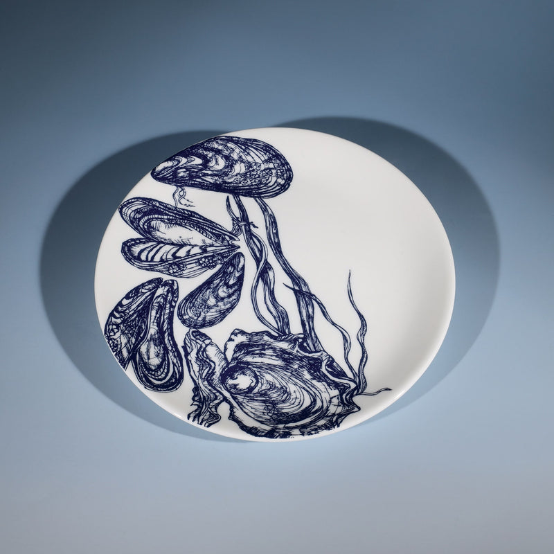 Bone China White plate with hand drawn illustrations of mussels and oysters on a side plate in Navy