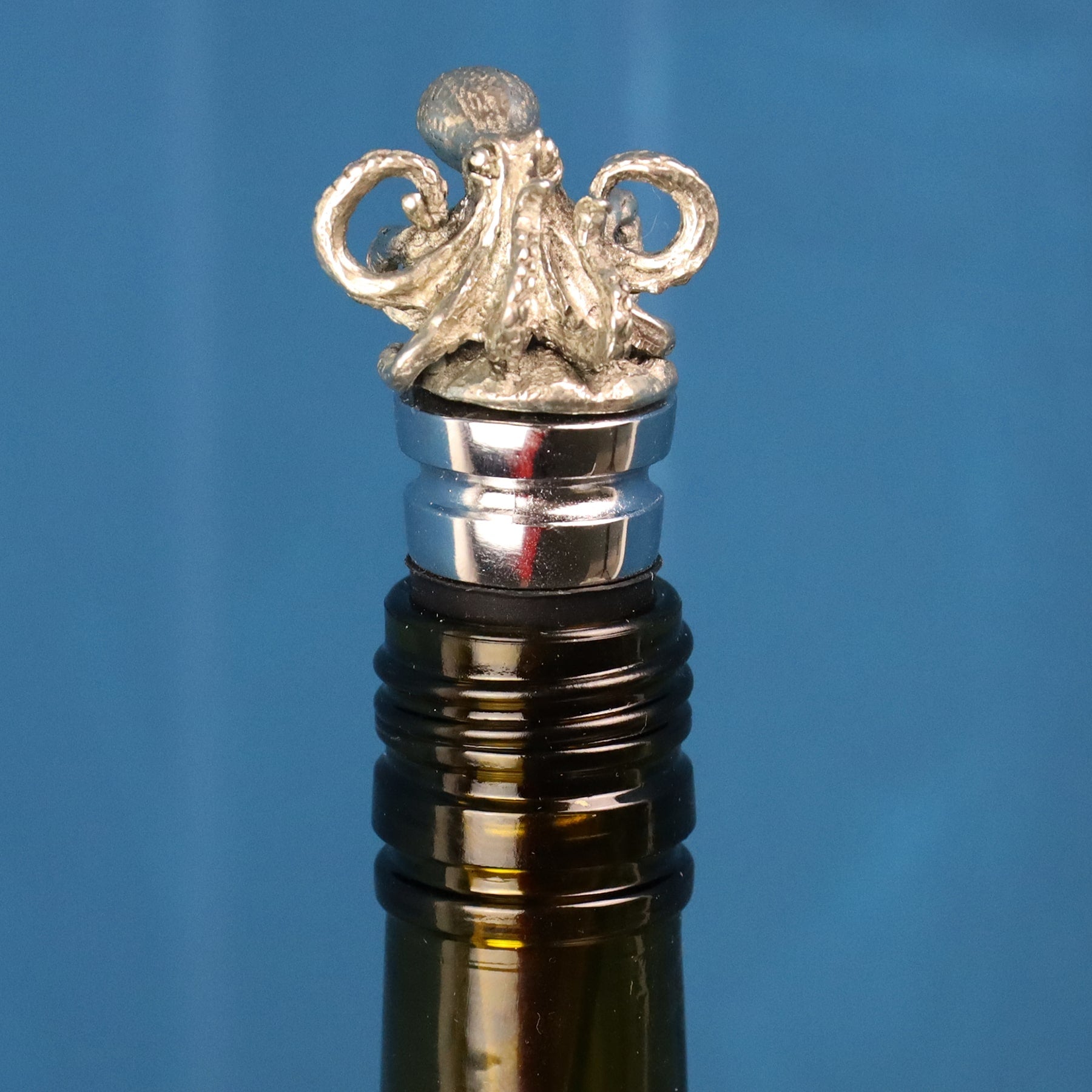 Pewter Octopus bottle stopper in the top of a bottle