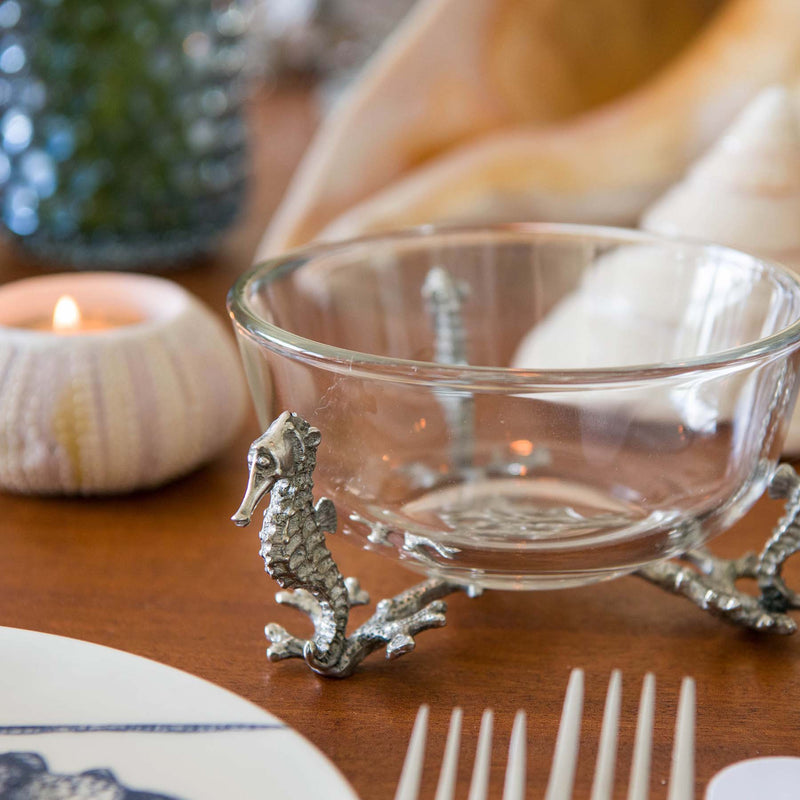 Close up of Pewter Octopus Glass Bowl placed on a table with some shells