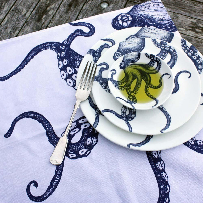 Outside Table setting with Large Octopus plate,side plate stacked with the nibbles bowl,on an octopus napkin