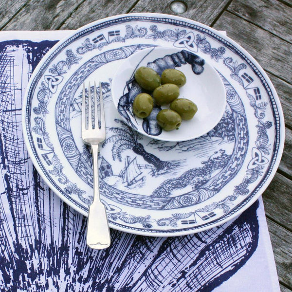Bone China White plate with beautifully hand drawn illustrations our classic Willow design with typically Cornish scenes in Navy.On the plate is a lobster nibbles bowl with green olives and a fork