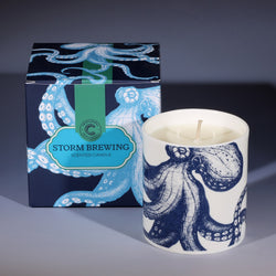 Blend of top notes of tea tree and orange, mid notes of juniper, rose, neroli and jasmine and base notes of green seaweed in a candle beaker illustrated with an octopus.